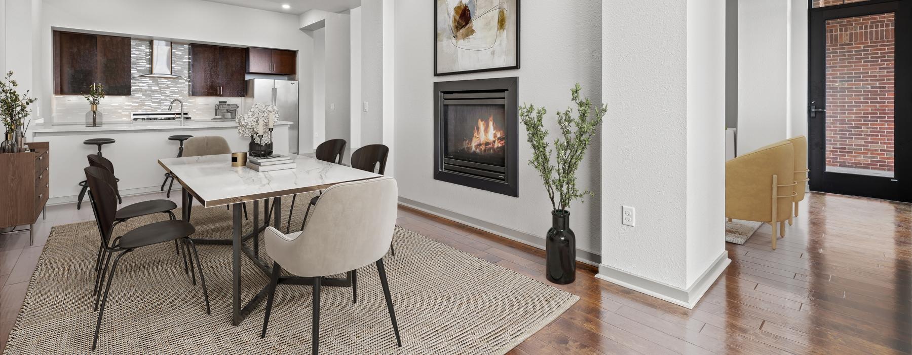 dining room with fireplace and kitchen