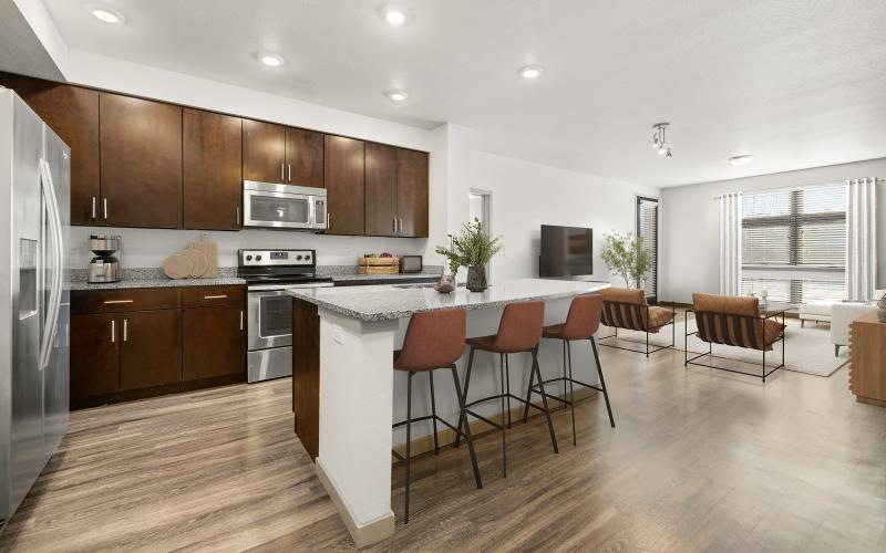 a kitchen with island and chairs