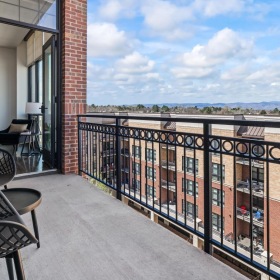 Spacious balconies private balcony with a table and chairs