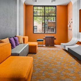 Access to resident-only features viewing room with couches and large tv