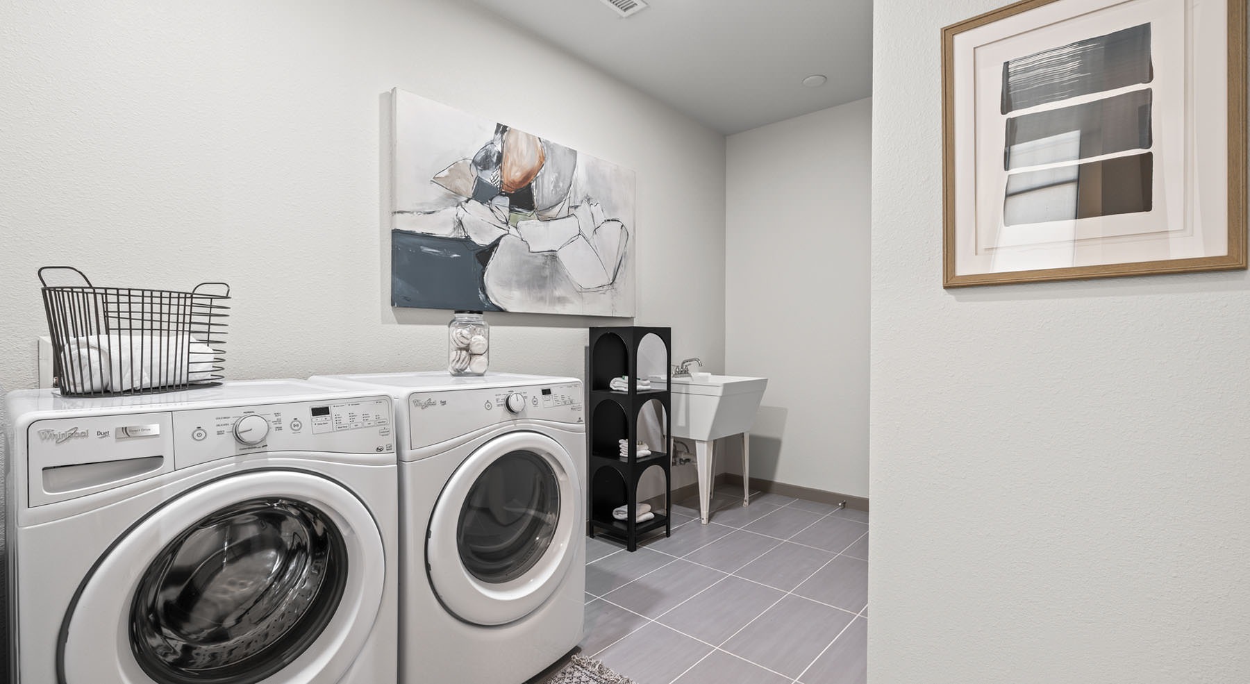 large laundry room with washer and dryer units