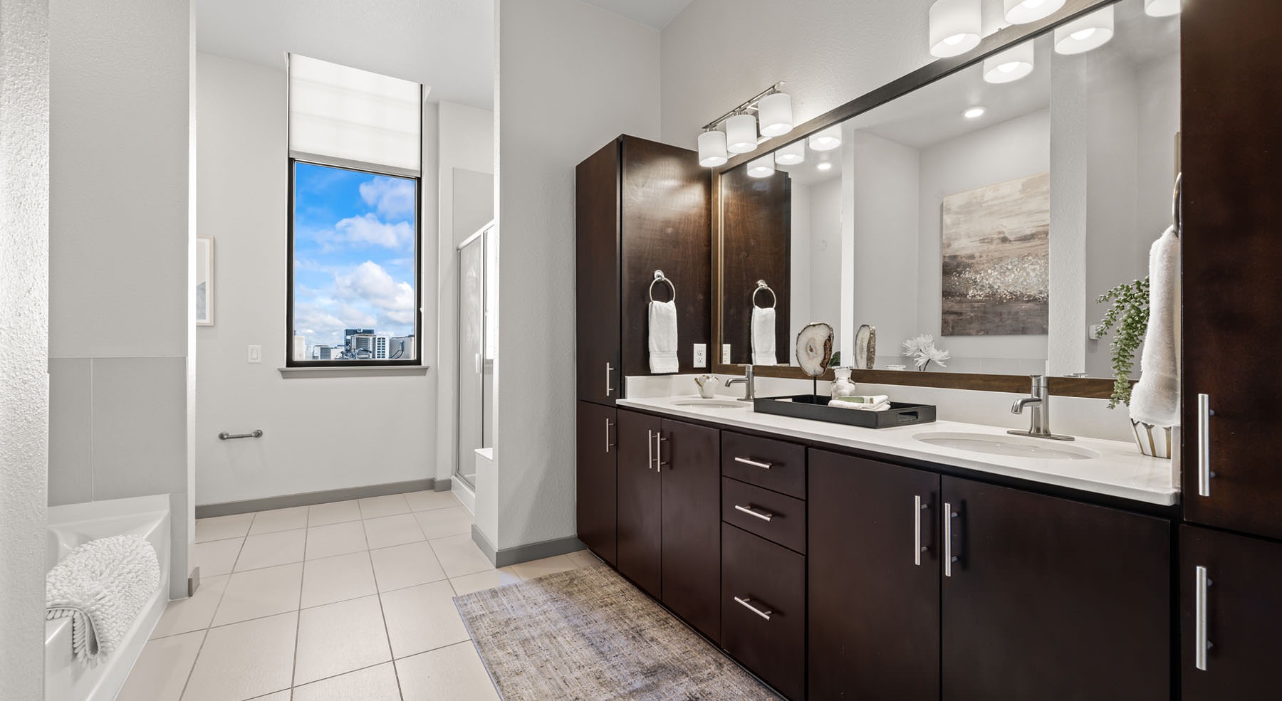 well lit bathroom with tub