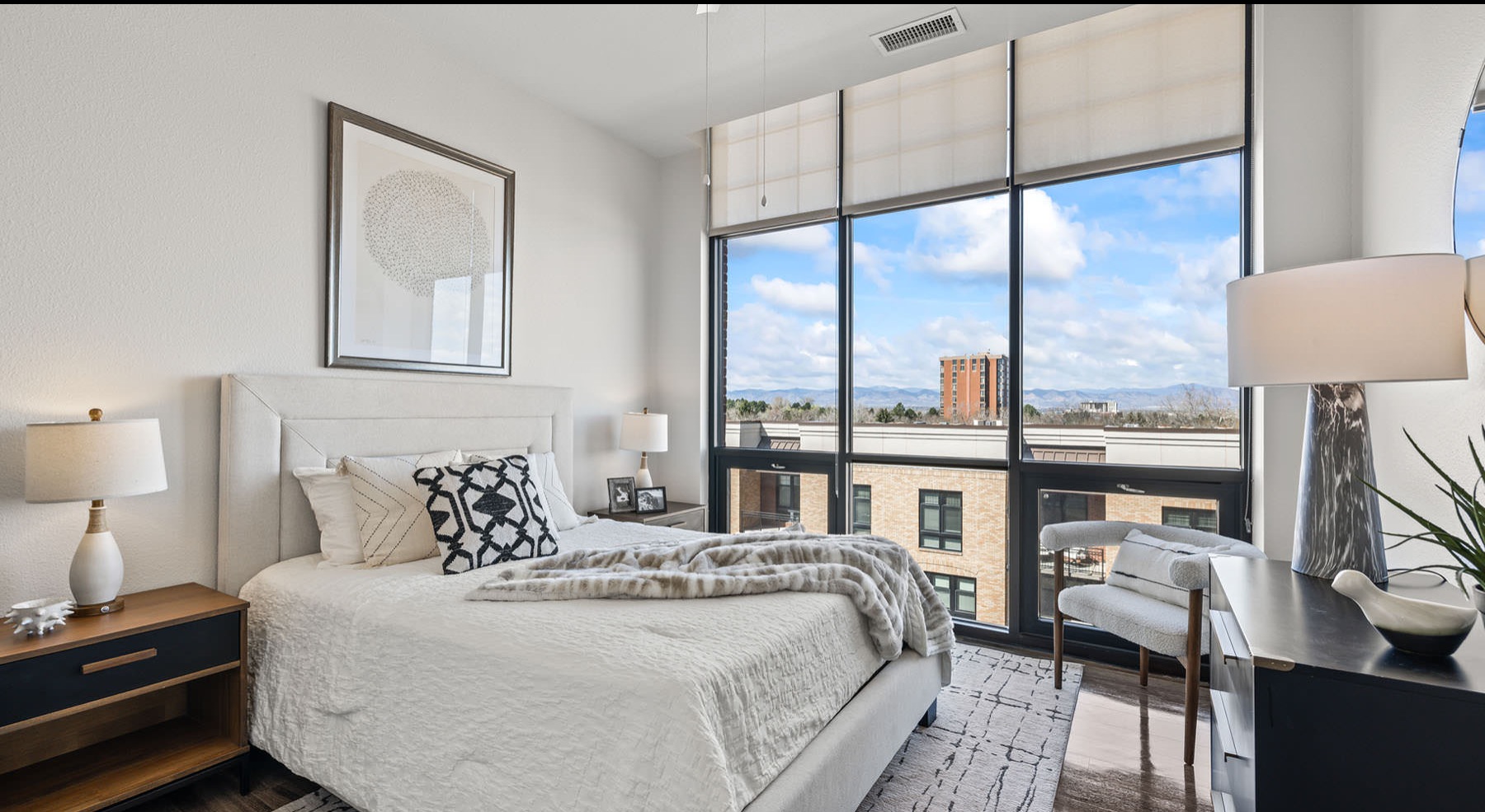 large windows with neighborhood views in bedroom
