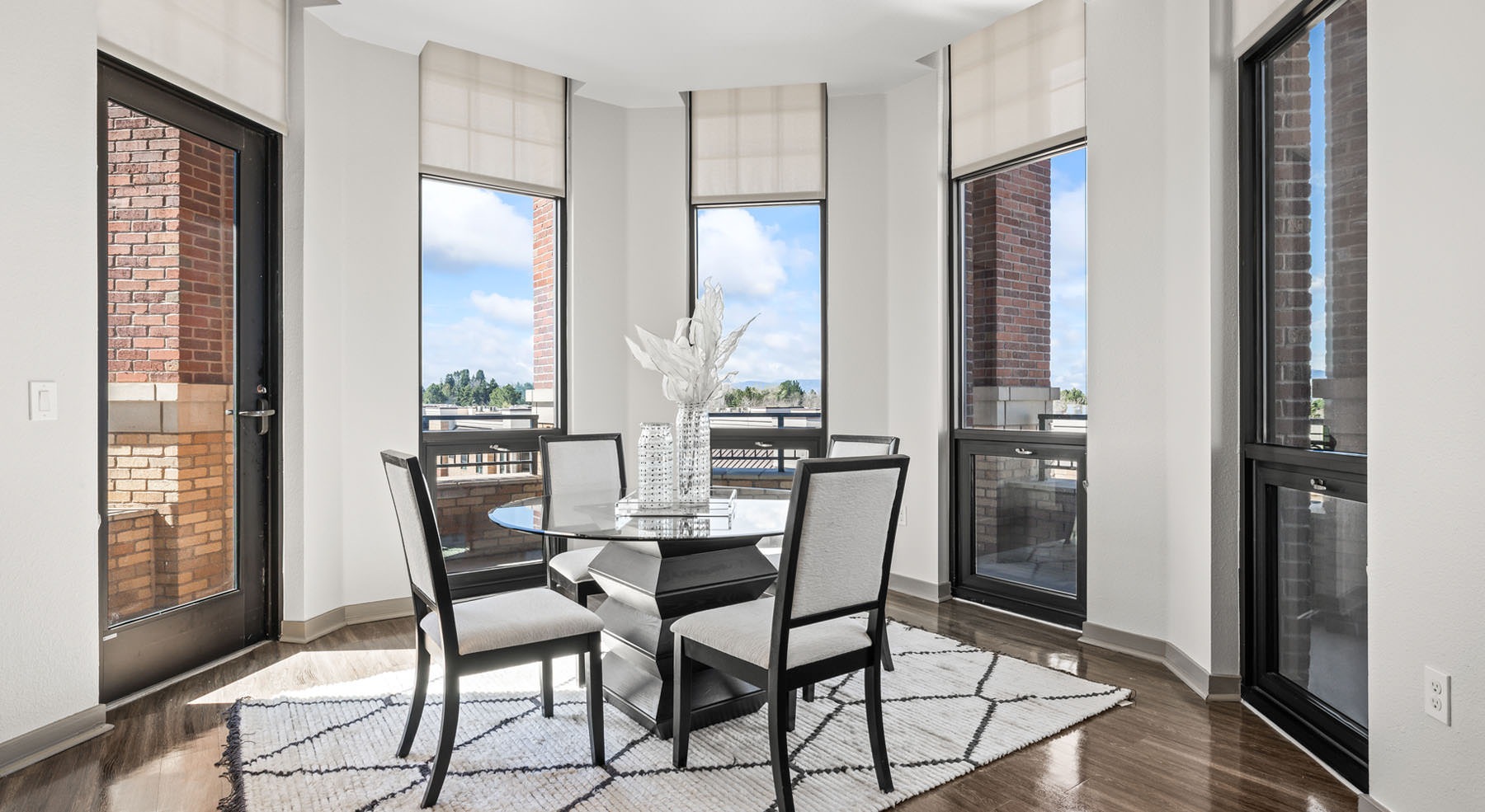 dining area surrounded by windows