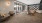 large bookshelf in clubroom with tables and chairs