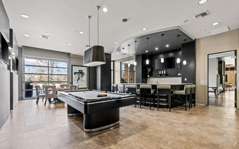 billiards table and kitchen in clubhouse
